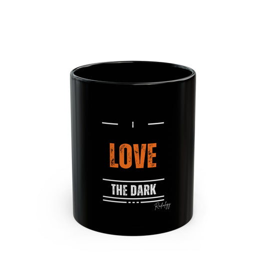 Black mug with 'Love the Dark' text on a white background