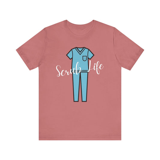 Pink t-shirt with blue scrubs graphic and 'Scrub Life' text on a white background